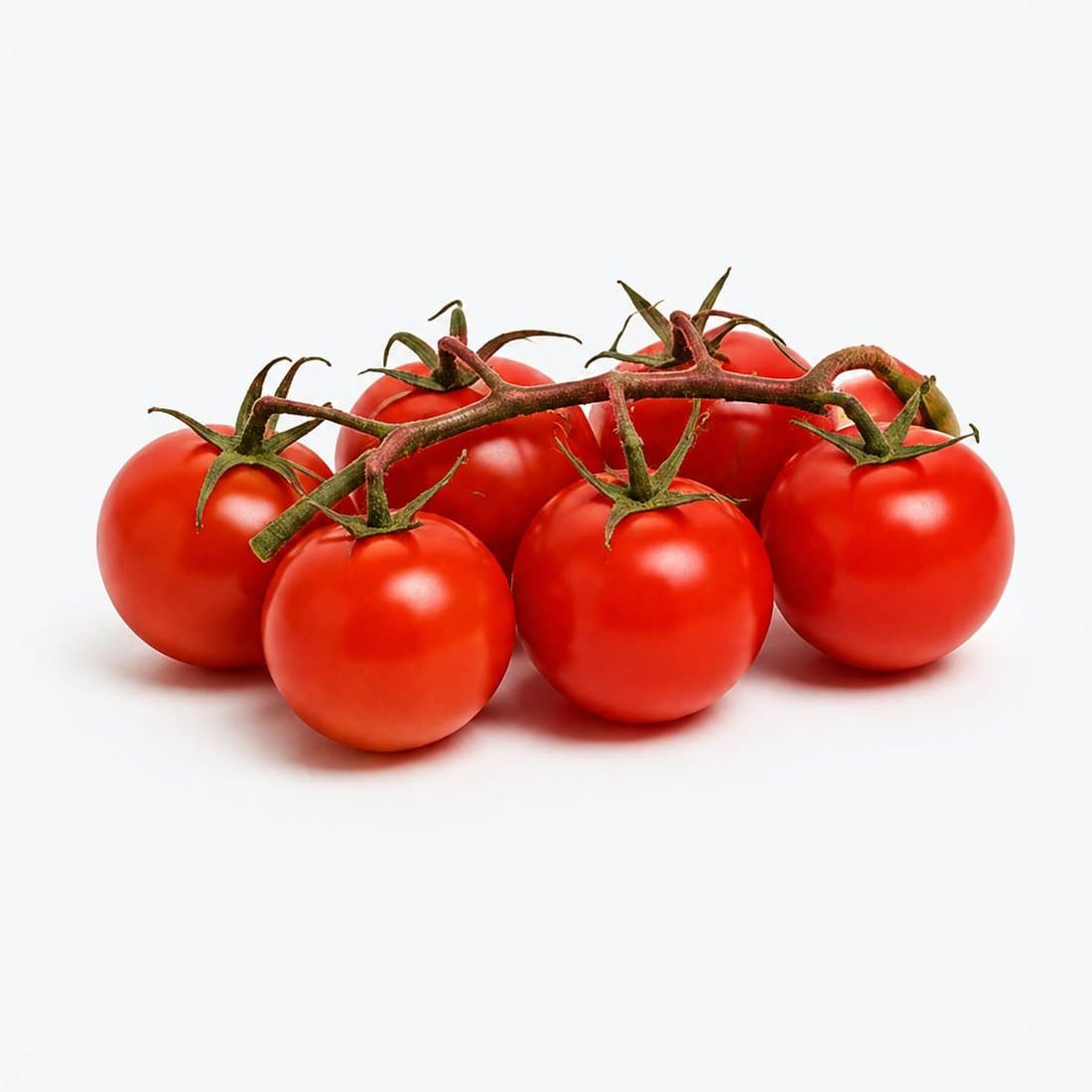 A truss of ripe cherry tomatoes on the vine