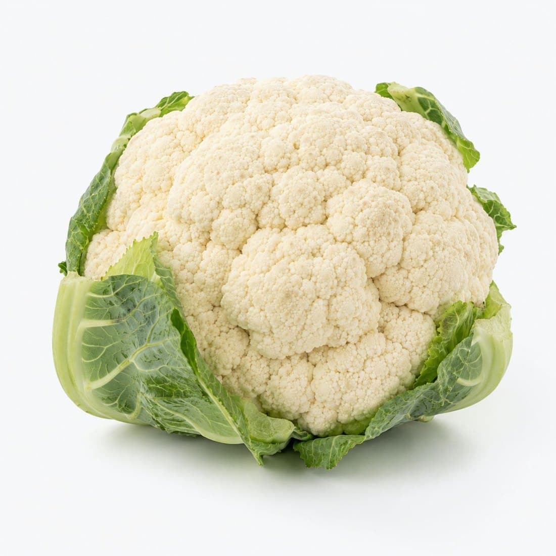 A whole cauliflower with outer leaves