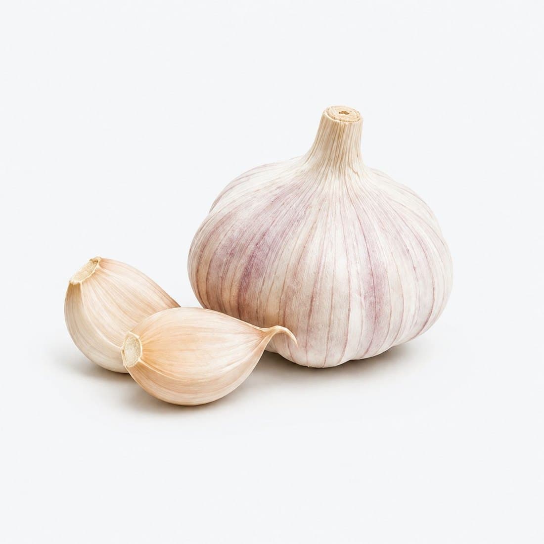 A garlic bulb with two loose cloves